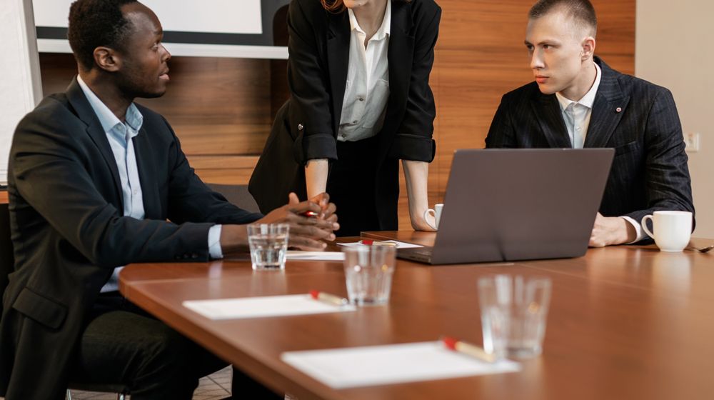 Team in a conference room assessing a market entry decision