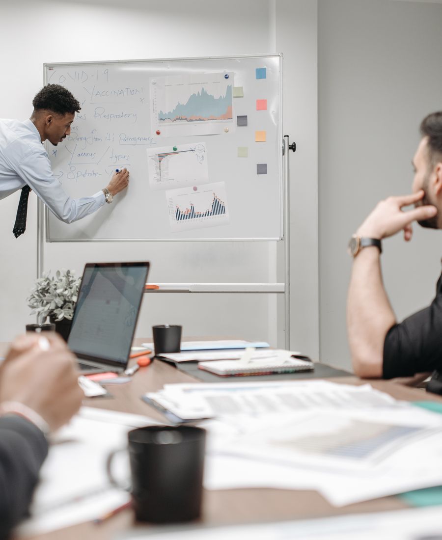 Consultants discussing a brief in the office